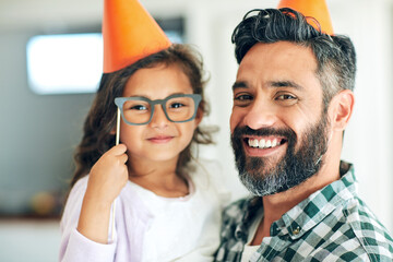 Father, child and portrait with birthday hats for celebration with eyeglasses, happy and props for...