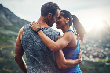 Fitness, couple and kiss on mountain for workout, outdoor marathon and training as team. Wellness,...