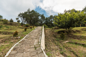 Tranquil Pathway to Nature’s Serenity: A Captivating Walk Through Verdant Hills and Lush Greenery