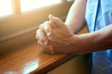 Hands together, anxiety or person with stress, fear and problem in home praying for hope. Closeup,...