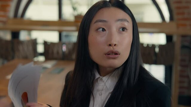 Three multiracial business people office Asian woman businesswoman showing document talk two multiracial men businessmen ignoring talking happy unequal rights gender discrimination patriarchy ignore