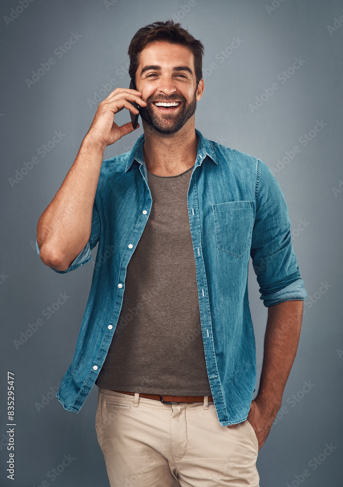 Poster phone call, smile and portrait of man in studio, cellphone and communication on gray background. int