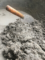 Construction concept, The mixing of stone, Cement, Sand together to make a strong concrete building