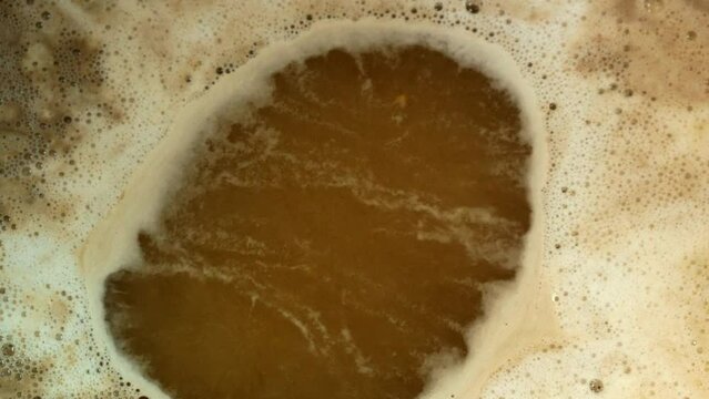 Beer wort boils during brewing in a brewery