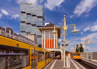 Yellow carriages of the famous Berlin metro on a sunny day.