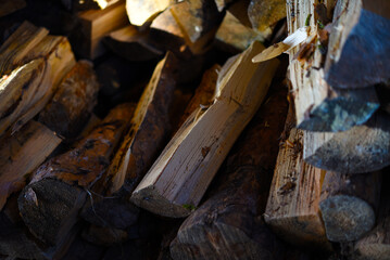 There's firewood in the closet. Stacked firewood. Storage of firewood.