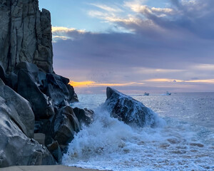 Colorful Sunrise Over Crashing Waves in the Ocean in Cabo San Lucas Mexico