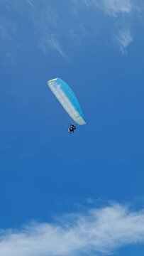 paragliding in the blue sky