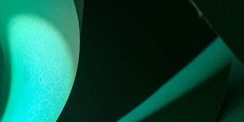 Abstract background with lights and shadows in green tones
