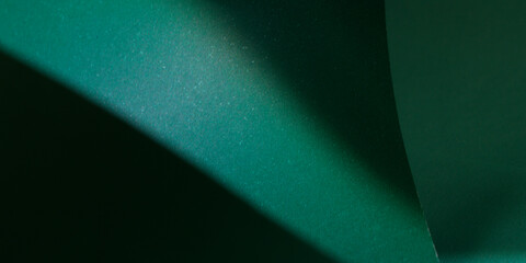 Abstract background with lights and shadows in green tones