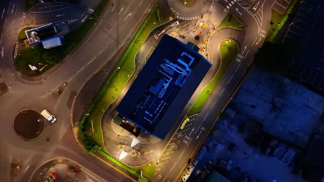 Top down view of drive thru fast food restaurant at night