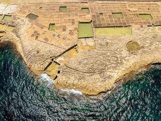 Famous touristic attraction in Gozo island the Salt Pans in  Xwejni Bay, Xwejni, Gozo island a part...