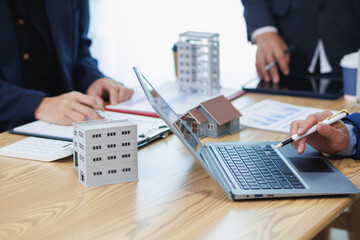 group of businessmen and investors discuss investing in real estate and jointly plan investments in construction projects of condominiums and apartments for sale and rent. investment advisory concept