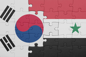 puzzle with the colourful national flag of syria and flag of south korea.