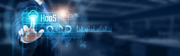 Businessman touching hardware as a service (HaaS) solutions network connection, data management and cloud computing infrastructure and services concept. Modern business transformation.