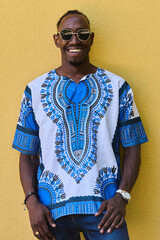 Sudanese Tradition Meets Modern Youth: African American Teen in Vibrant Traditional Attire Against...