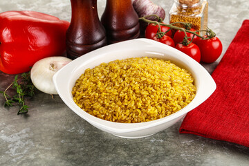 Dry wheat bulgur cereal heap