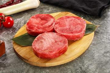 Delicous raw tuna medallion for cooking