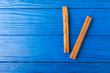 Ceylon cinnamon.Cinnamon sticks on a textured wooden background. Cinnamon roll and powder. Spicy spice for baking, desserts and drinks. Fragrant ground cinnamon. Close-up. Place for text. copy space