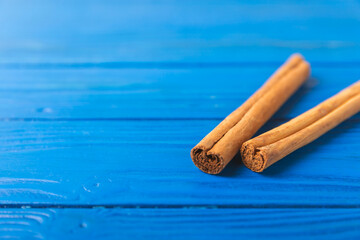 Ceylon cinnamon.Cinnamon sticks on a textured wooden background. Cinnamon roll and powder. Spicy spice for baking, desserts and drinks. Fragrant ground cinnamon. Close-up. Place for text. copy space