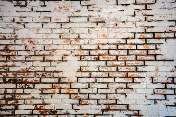 Weathered White Brick Wall with Rustic Red Accents - Textured Background for Urban and Industrial Design Projects