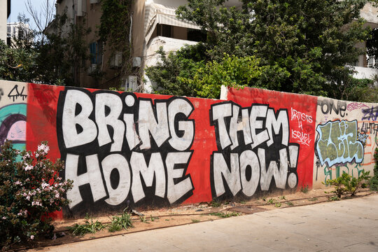 Tel Aviv, Israel - March 29, 2024. Bring Them Home graffiti on the wall