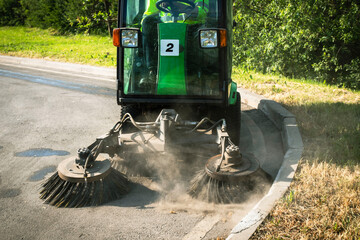 Street Sweeper With Rotating Brushes Cleaning Asphalt Pavement