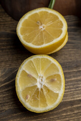 slices of sour lemon on a black board
