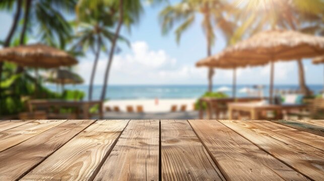 Empty wooden tabletop and blurred background of summer resort beach bar for display or montage your products