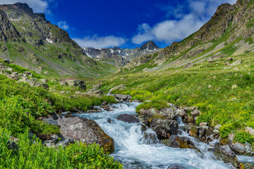 The Kaçkar Mountains are a lush green valley in the south and a stream fed by snow water.