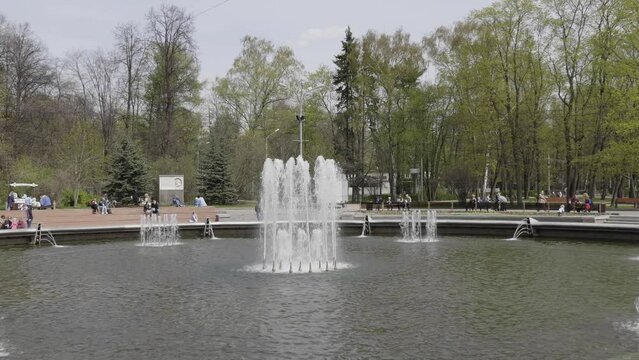 Sokolniki park, sunny spring day fountains on the central alley in Moscow, Russia.