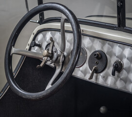 Dashboard and steering wheel of old-timer car