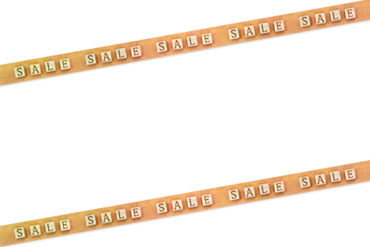 上下斜めに貼られた赤みを帯びたセールの英語ブロックが繰り返される黄色いマスキングテープ