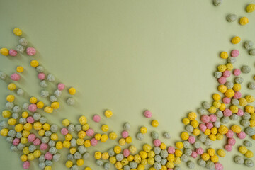 Sweet multi-colored flakes on a colored background. Fast food concept, space for text