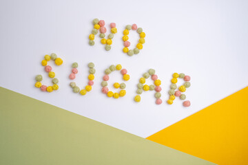 Words NO SUGAR made from colored flakes on a light background. Diet healthy nutrition concept