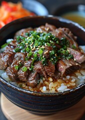 Donburi - Rice bowl topped with beef (gyudon), chicken (oyakodon), or seafood. 