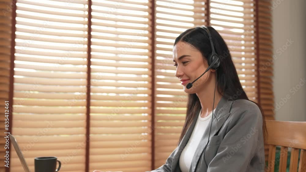 Aufkleber female call center operator or customer service helpdesk staff working on workspace while talking on