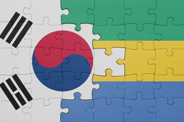 puzzle with the colourful national flag of gabon and flag of south korea.