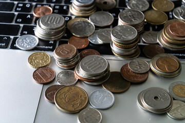 View of the various coins on the laptop