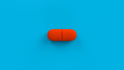 Red single pill isolated on a blue background. Tablet, pill capsule top view, flat lay. 3d render illustration 