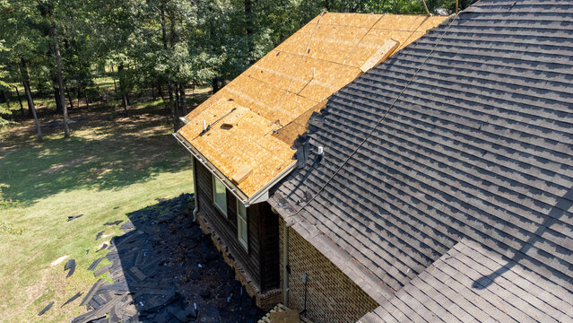 House with new roof being installed