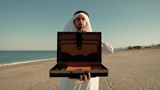 Sheik Opening The Briefcase Towards The Camera 