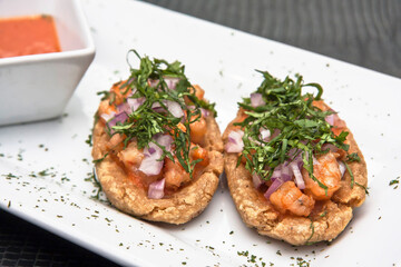 Mexican food, shrimp sopes with spicy sauce, cilantro and onion, Mexican craving for corn tortilla