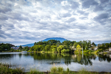 Fototapeta premium mount fuji covered in clouds, kawaguchi lake, early morning, kawaguchiko, japan, iconic, reflection
