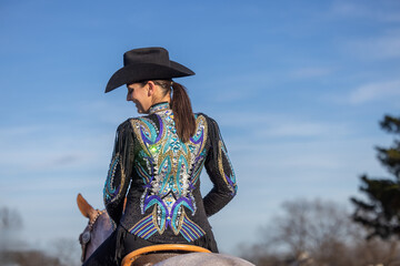 Equestrian horseback back view wearing western equestrian show western pleasure attire 