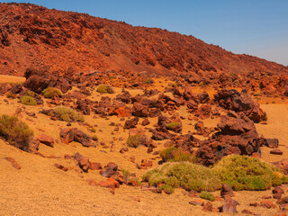 spot in Tenerife with many red rocks and beautiful mountain landscape background
