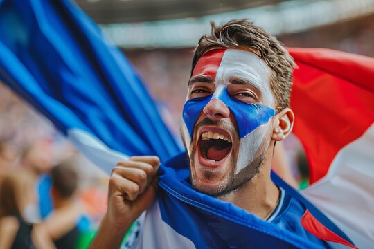 An enthusiastic sports fan with the Dutch flag painted on his face, expressing support
