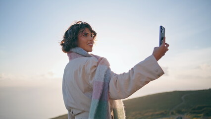 Travel woman taking picture beautiful nature views on smartphone closeup.