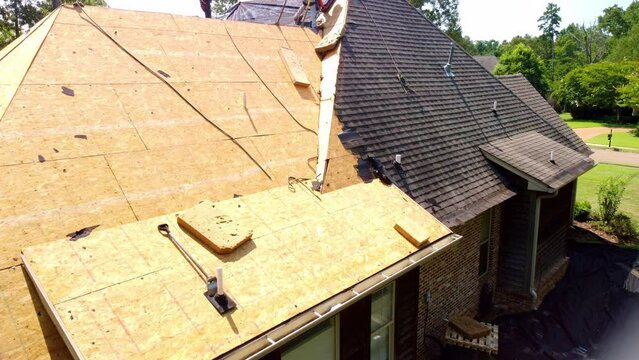 House with new roof being installed