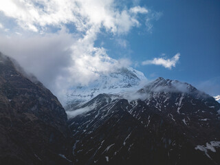 clouds over the mountains, mountains in the fog, during annapurna, annapurna base camp nepal